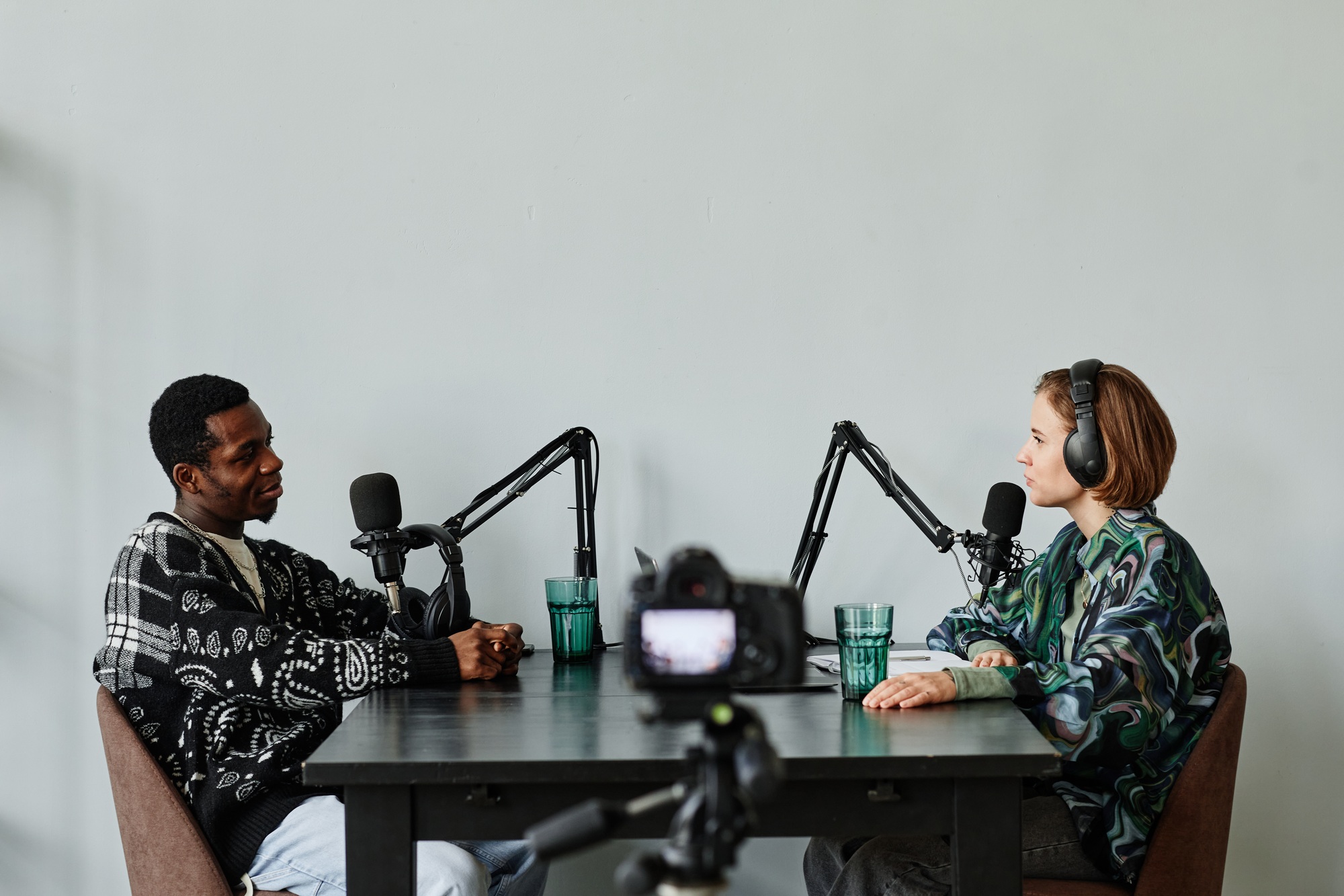 Two People Recording Podcast Side View